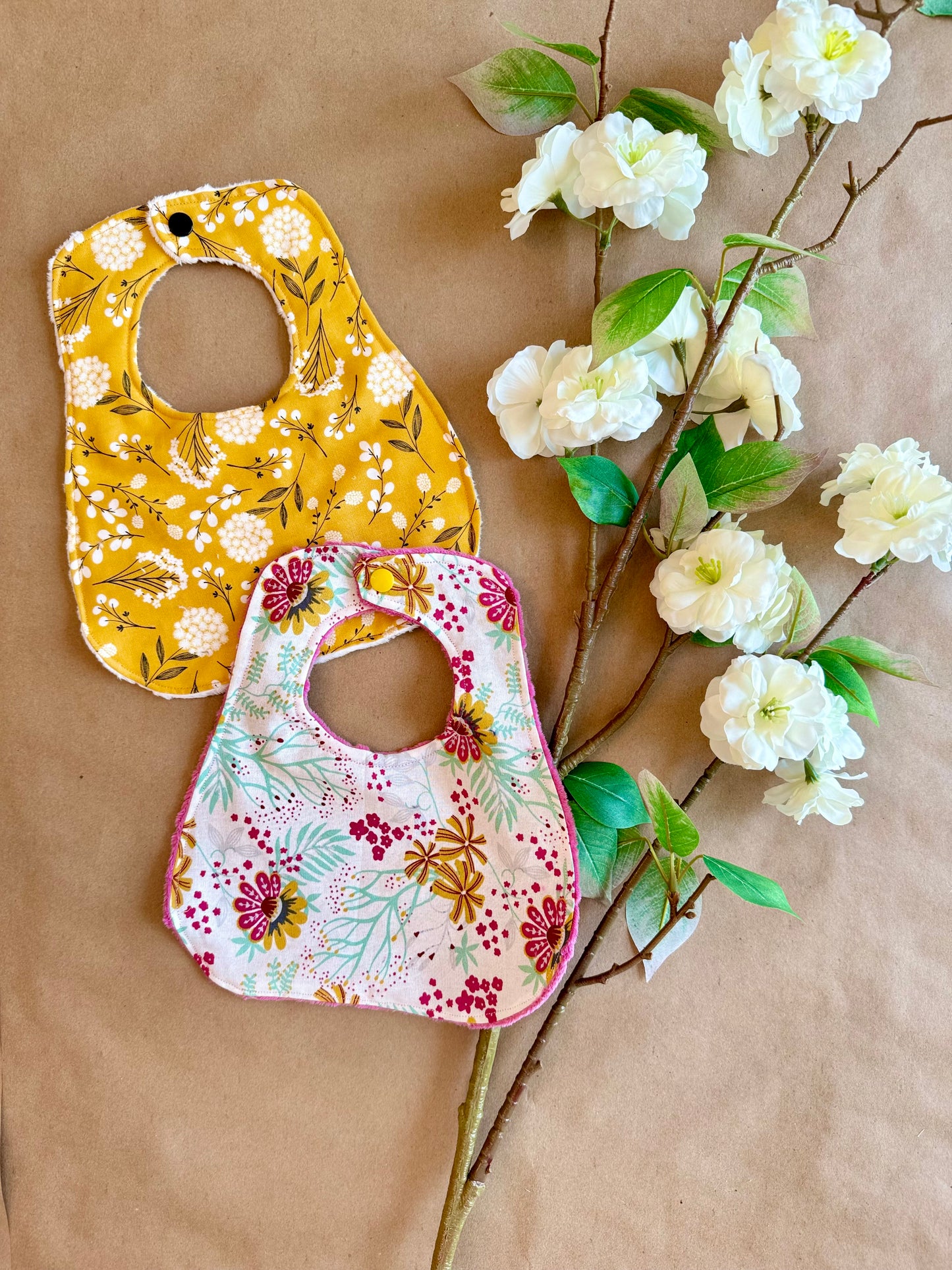 infant newborn baby girl flowers wildflowers mustard floral bibs nursing cotton minki minky plastic snap button