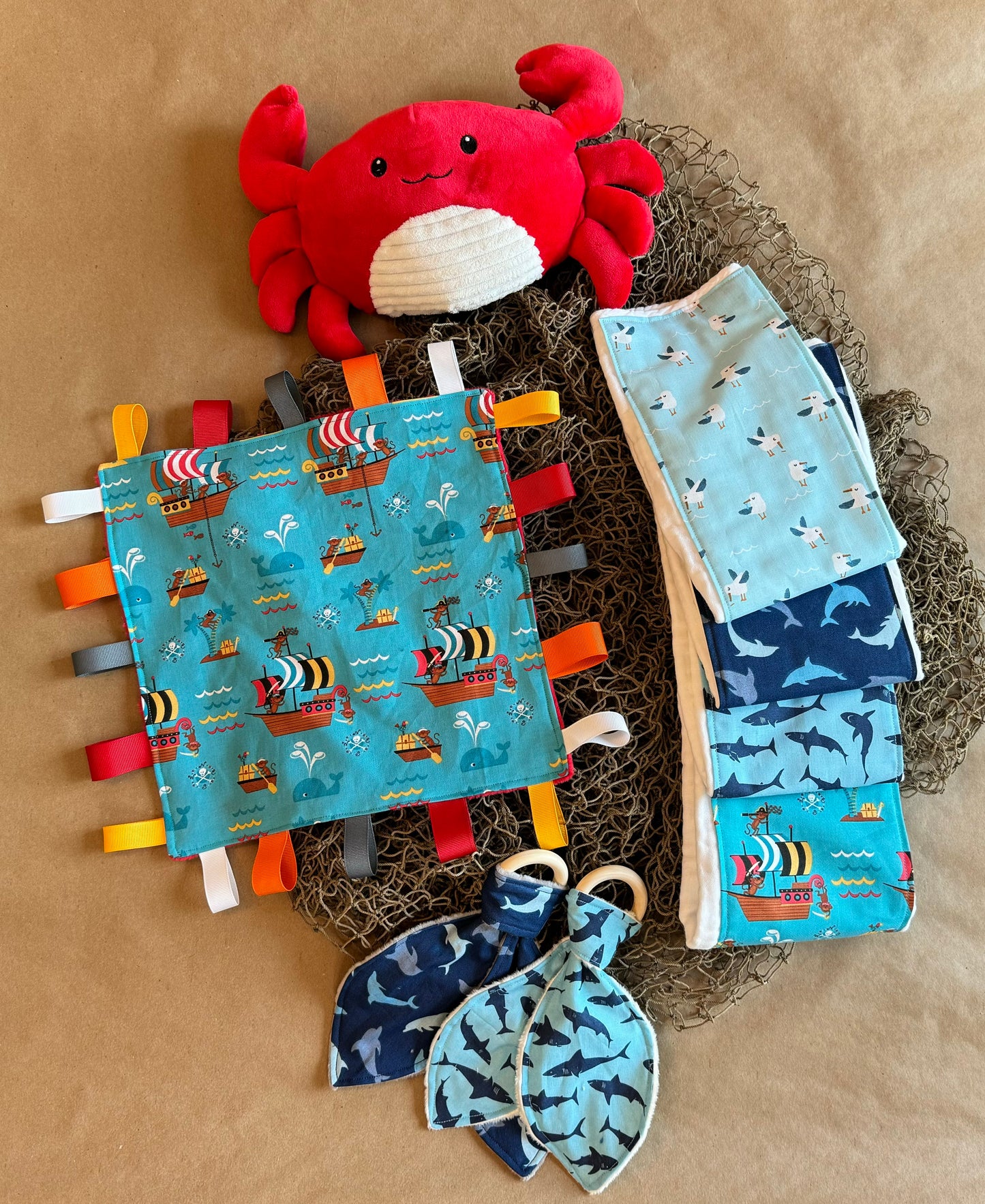 sharks seagulls dolphins monkey pirates ocean life sea life ahoy teether teething ring wood sensory tag blanket grosgrain ribbon burp cloth diaper cotton minki minky newborn infant baby boy